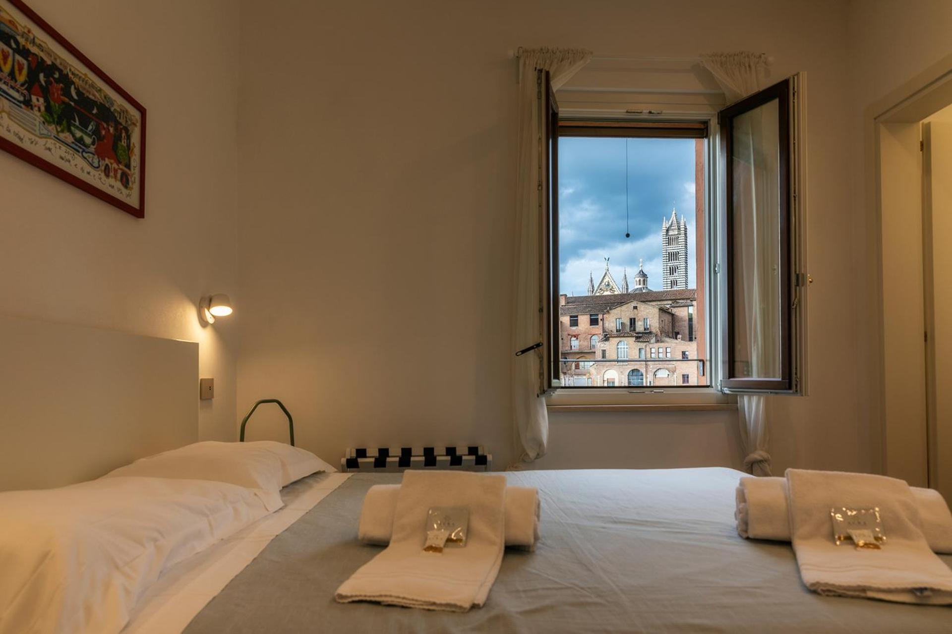 The View Apartment Siena Bagian luar foto